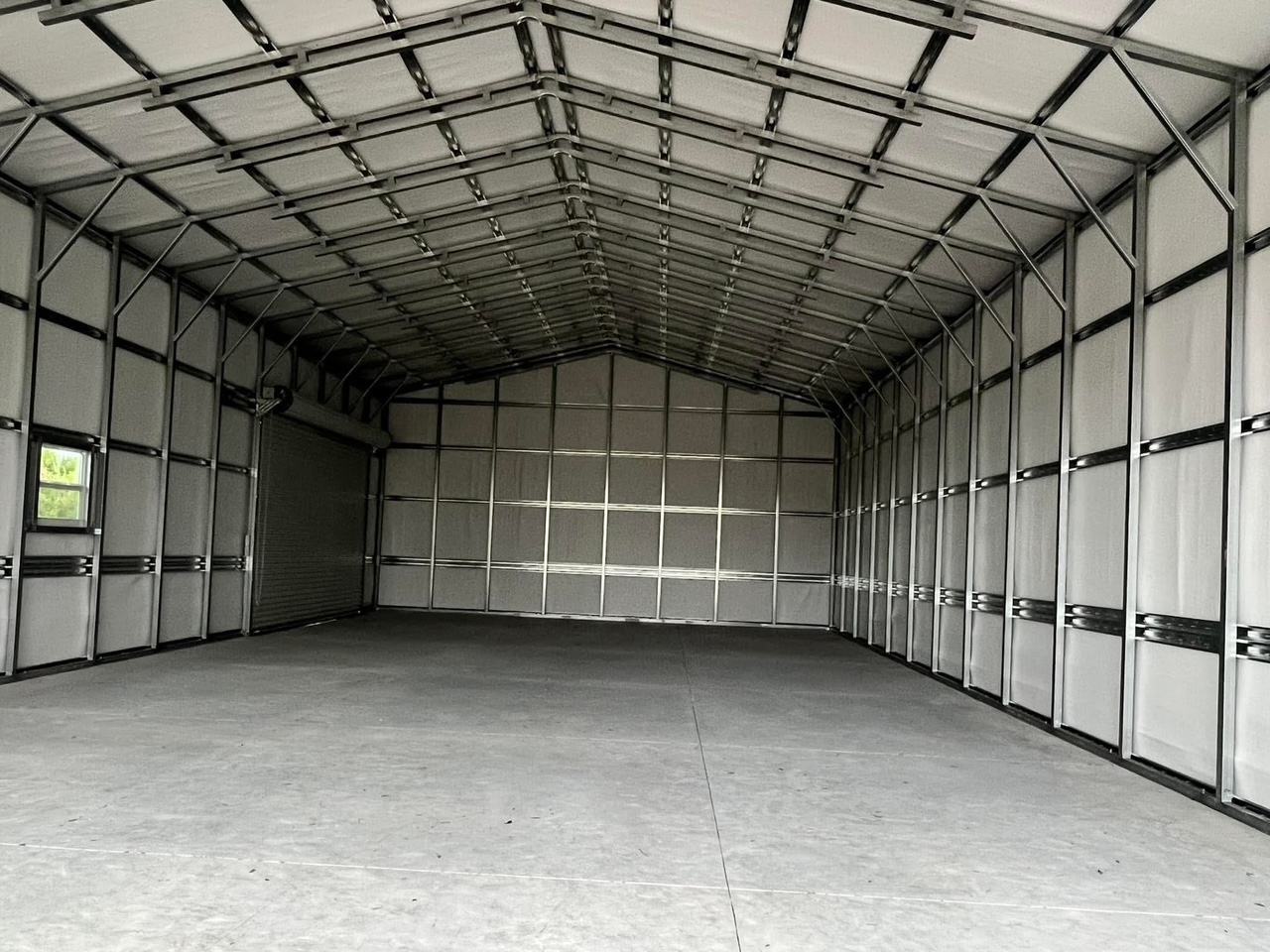 Garage: 28x51x14 Utility Garage with Three Roll-Up Doors — image from the original listing