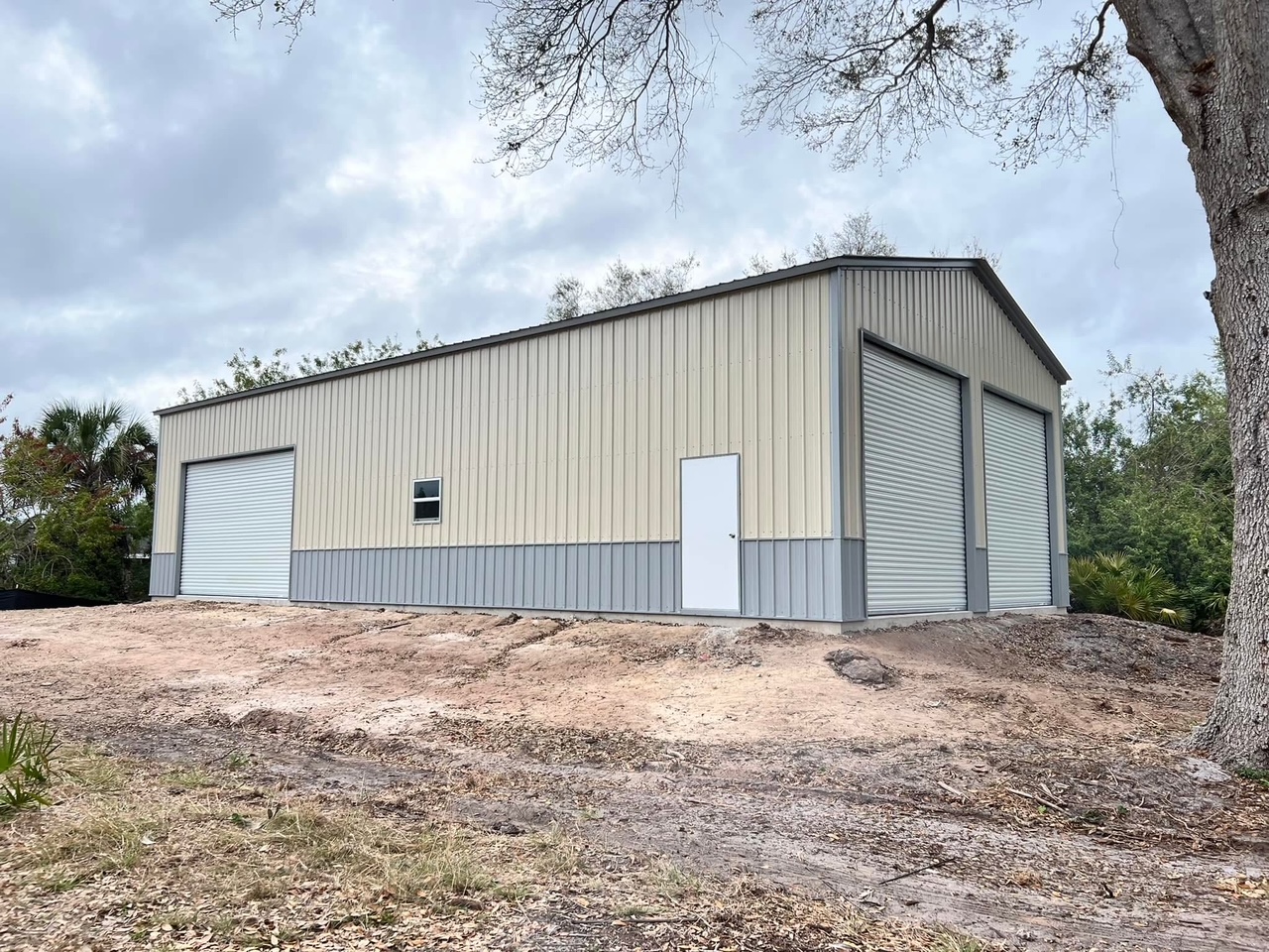 Garage: 28x51x14 Utility Garage with Three Roll-Up Doors — image from the original listing